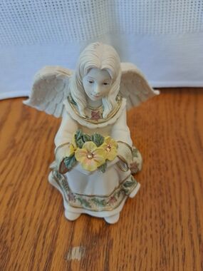 Porcelain Angel Figurine with Yellow Flowers - November